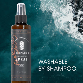 Hairplexx bottle in hand to show 6.76 fl oz size and portability benefit