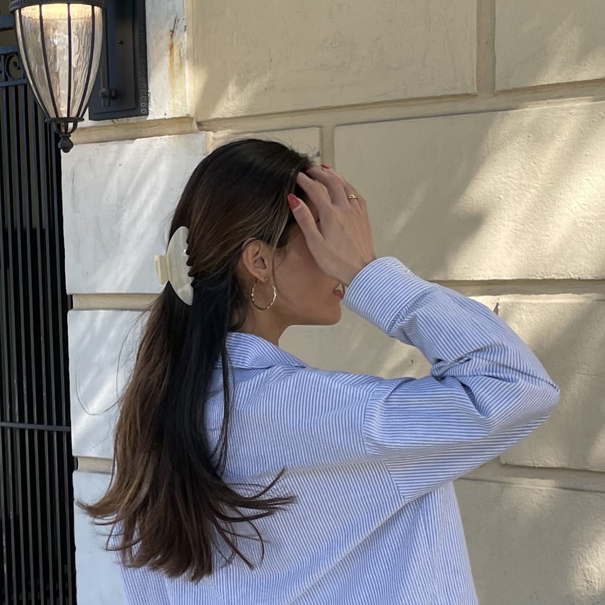 Hana Mia clip securing long hair in a neat half-up for quick styling