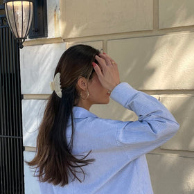 Hana Mia clip securing long hair in a neat half-up for quick styling