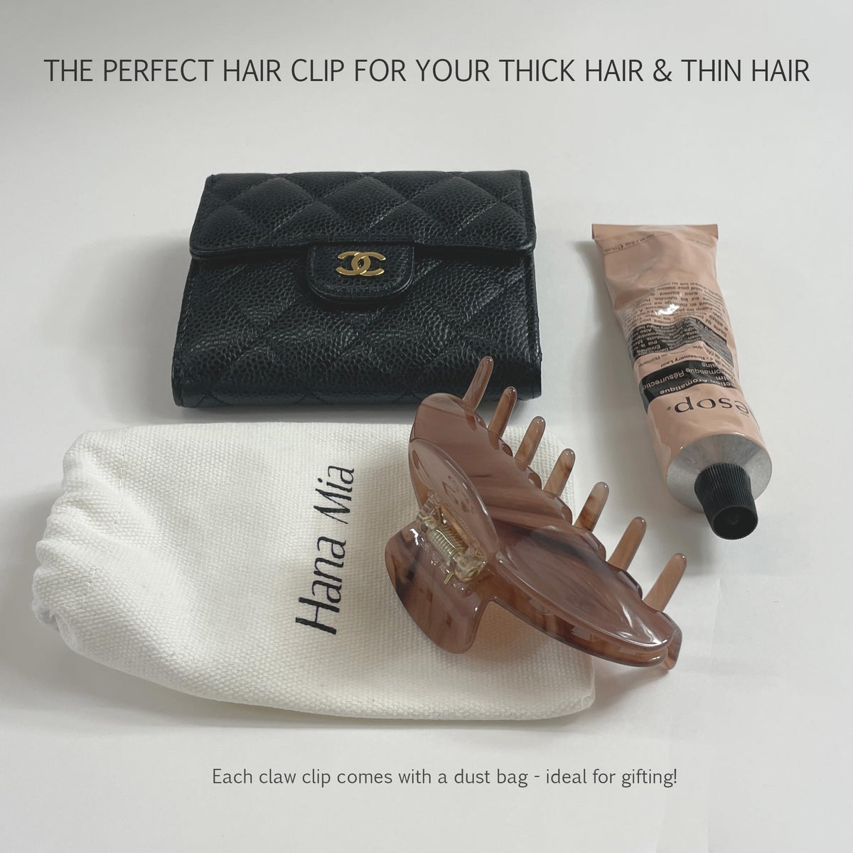 Hana Mia held next to a ruler to show 4-inch scale for gathering long and thick hair