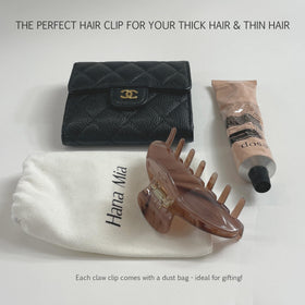 Hana Mia held next to a ruler to show 4-inch scale for gathering long and thick hair