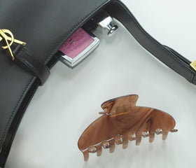 Hana Mia packed inside a suitcase pocket demonstrating travel-ready convenience and protection