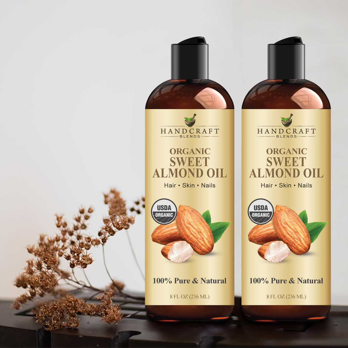 Handcraft Blends bottle beside towel and candle in bath setting for relaxing routine