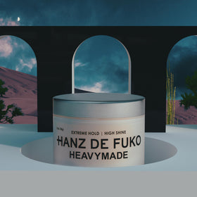 Hanz de Fuko 2 oz jar next to passport to show travel-friendly size