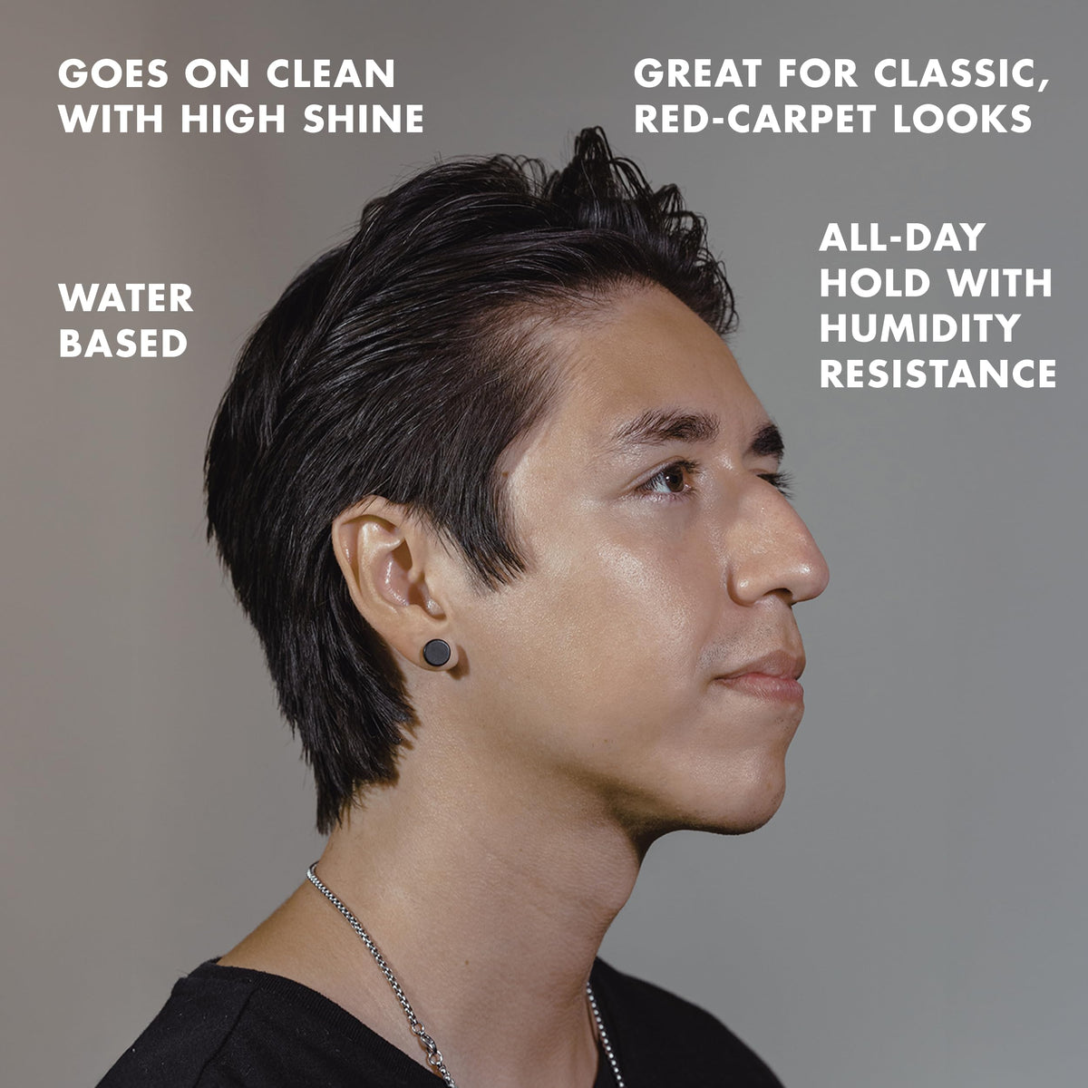 Model with slicked-back hair using Hanz de Fuko for polished high shine