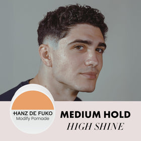 Hanz de Fuko Modify Pomade in hand showing glossy finish for classic styles