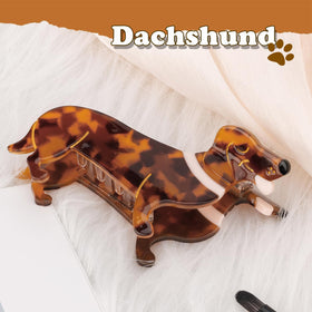 Hapdoo dachshund clip in hand for scale showing compact, portable size