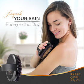 Happy Sol brush held in hand demonstrating dry brushing motion and circulation benefit