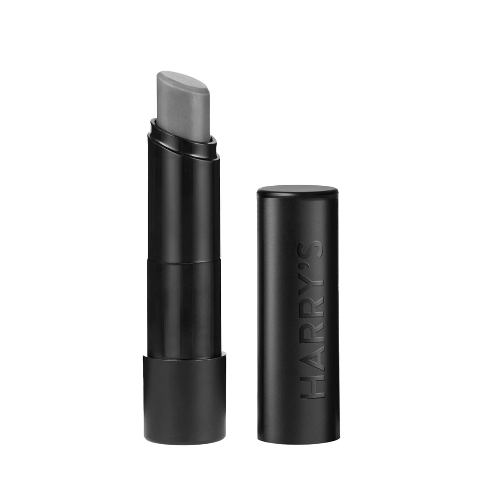 Harry's front tube showing sleek black packaging and portability benefit