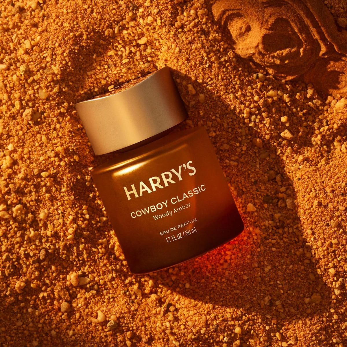 Harry's bottle held in hand to show 1.7 fl oz size and portability