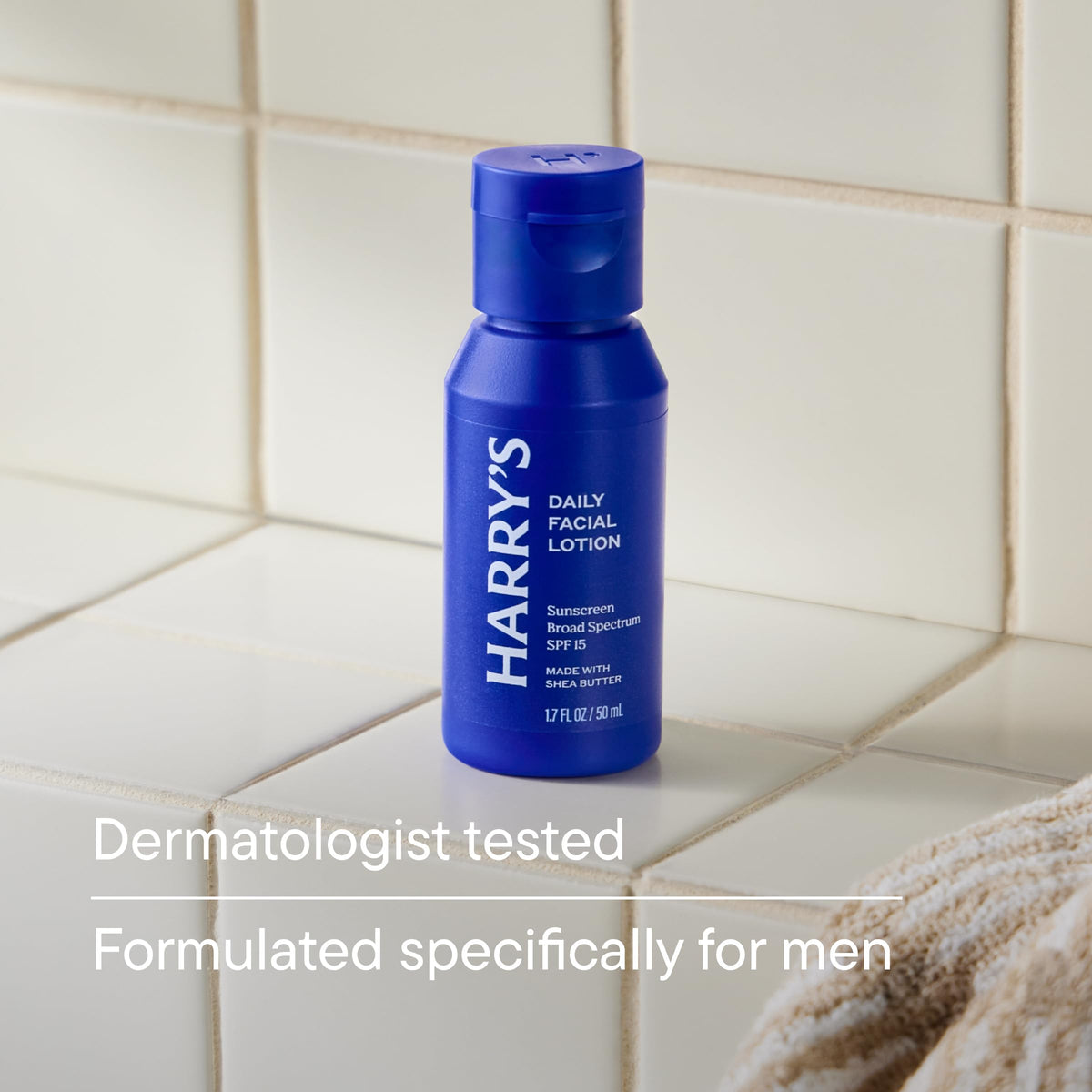 Harry's bottle with cap open and lotion dispensing to show travel-friendly application