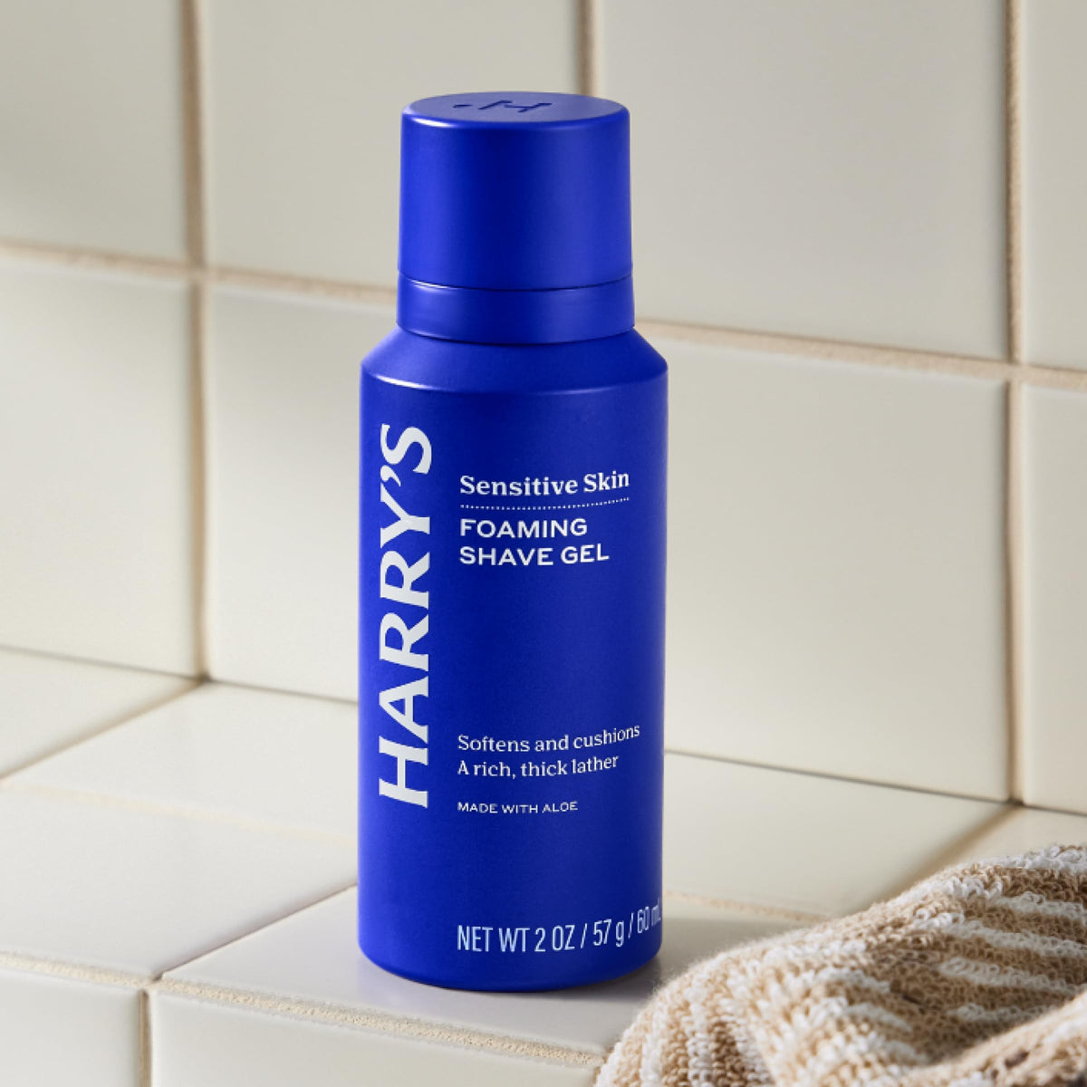 Harry's foaming shave gel creating rich lather in hand to cushion skin during shave
