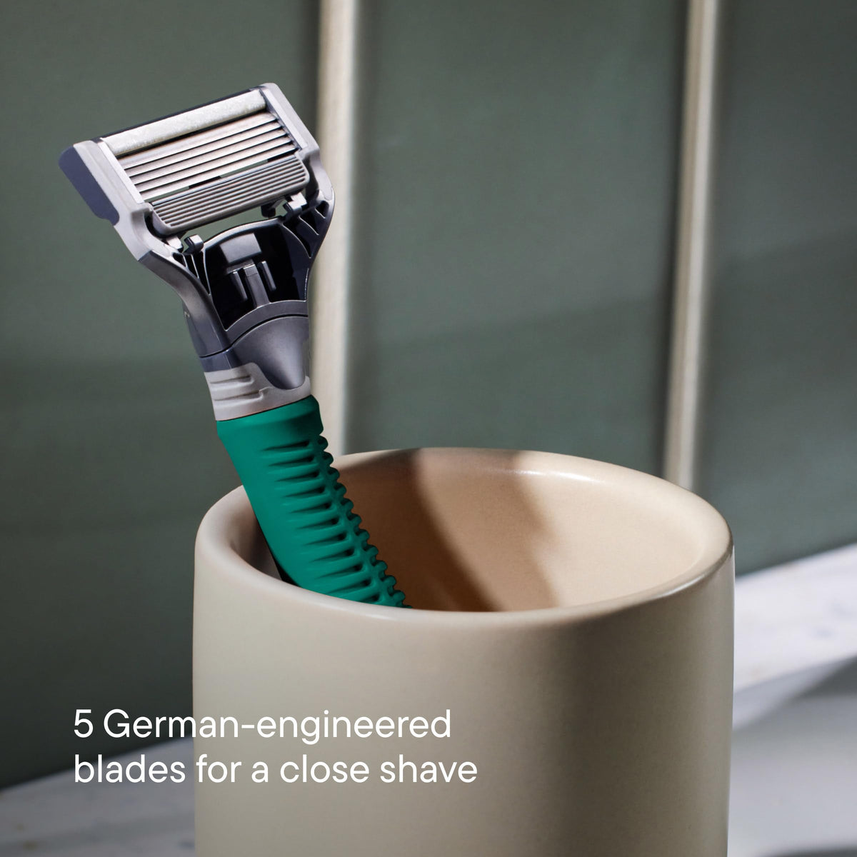 Harry's textured grip and weighted core offering stable hold while shaving
