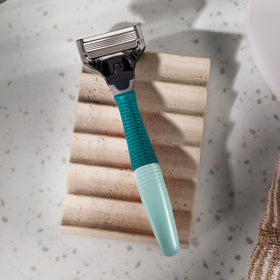Harry's lubricating strip and blade angle detail for reduced irritation
