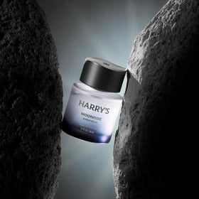 Harry's Moonrise held in hand to show 1.7 fl oz scale benefit: travel-friendly size