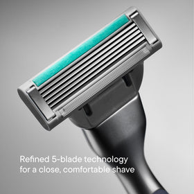 Harry's handle held in hand to show scale and balanced weighted design