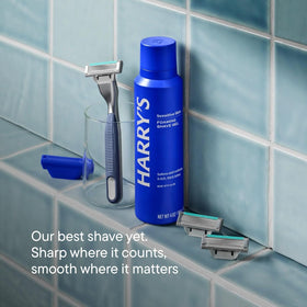 Man shaving with Harry's kit in bathroom showing comfortable shave