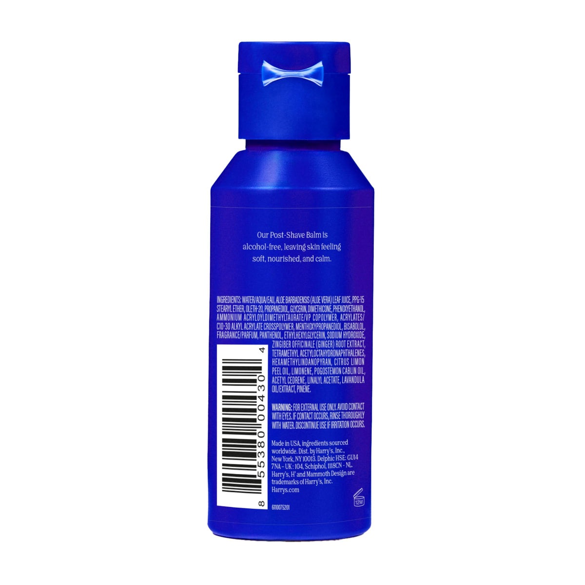 Harry's bottle beside a razor for scale to show compact grooming size