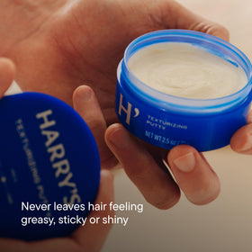 Harry's putty held between hands during application, demonstrates easy workability