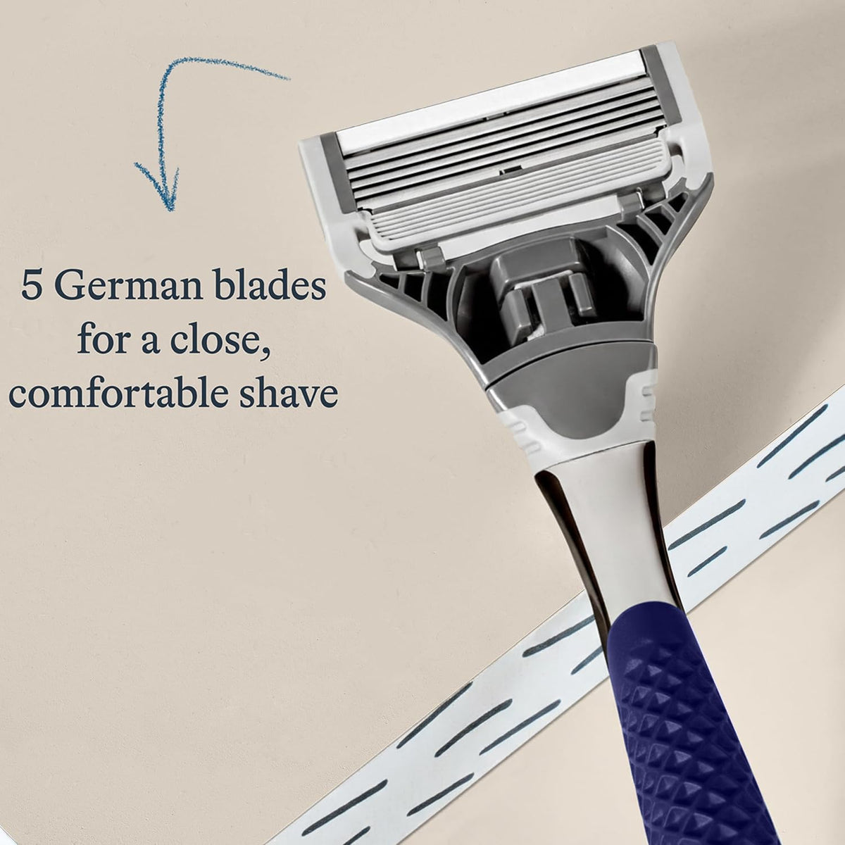 Harry's razor held in hand for scale illustrating balanced weight and ergonomic control