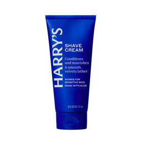 Man using Harry's shave cream in bathroom for a refreshing morning shave