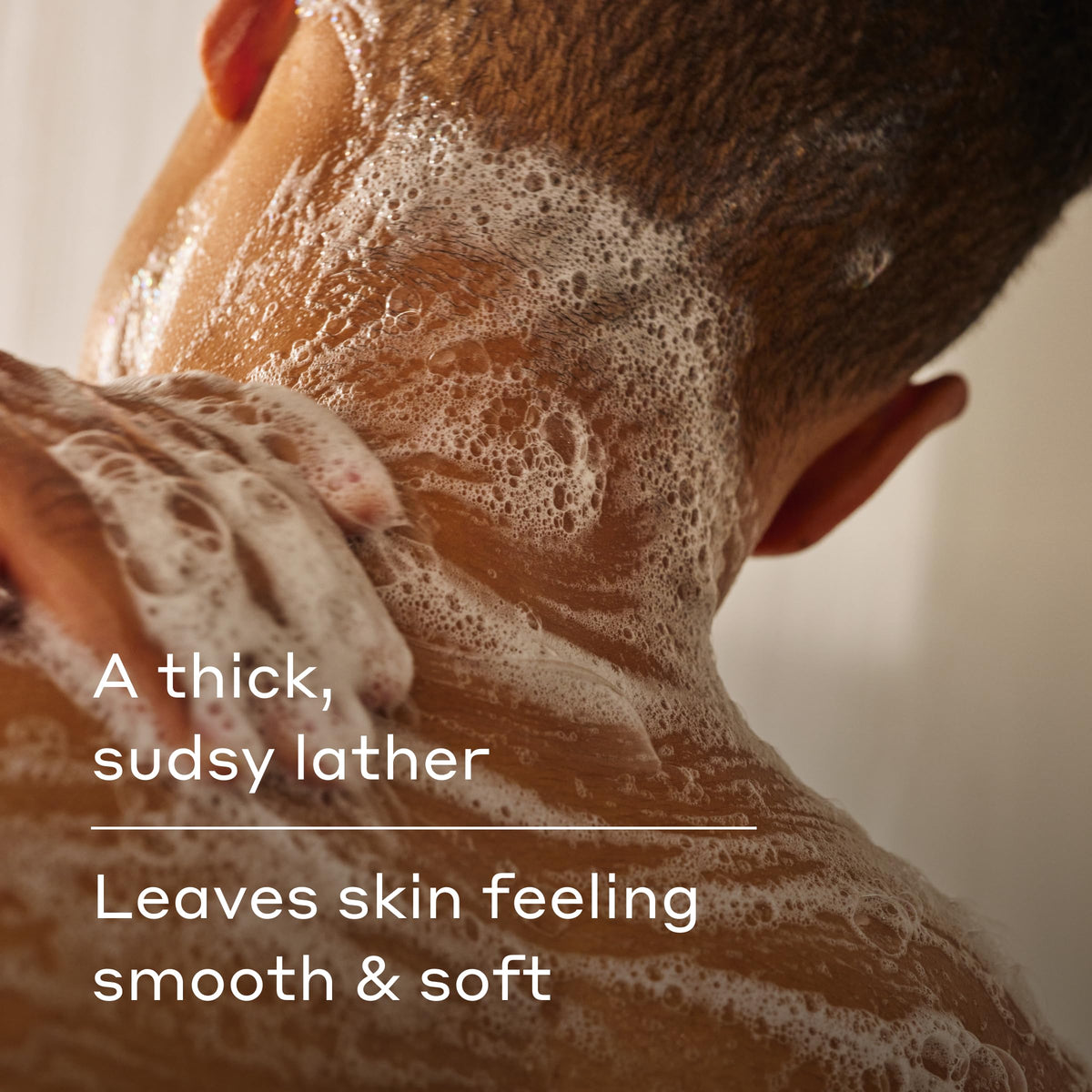 Harry's Stone lather in hand illustrating rich foam and gentle cleansing