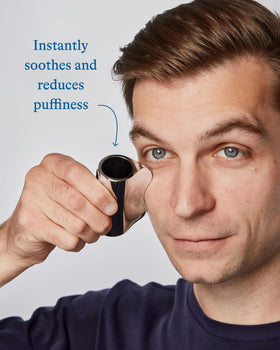 Harry's tool placed on vanity beside lotion showing routine pairing and streamlined grooming benefit