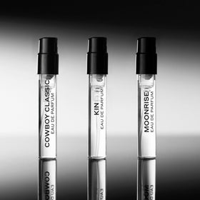 Harry's compact vials inside a toiletry bag showing travel convenience and protection