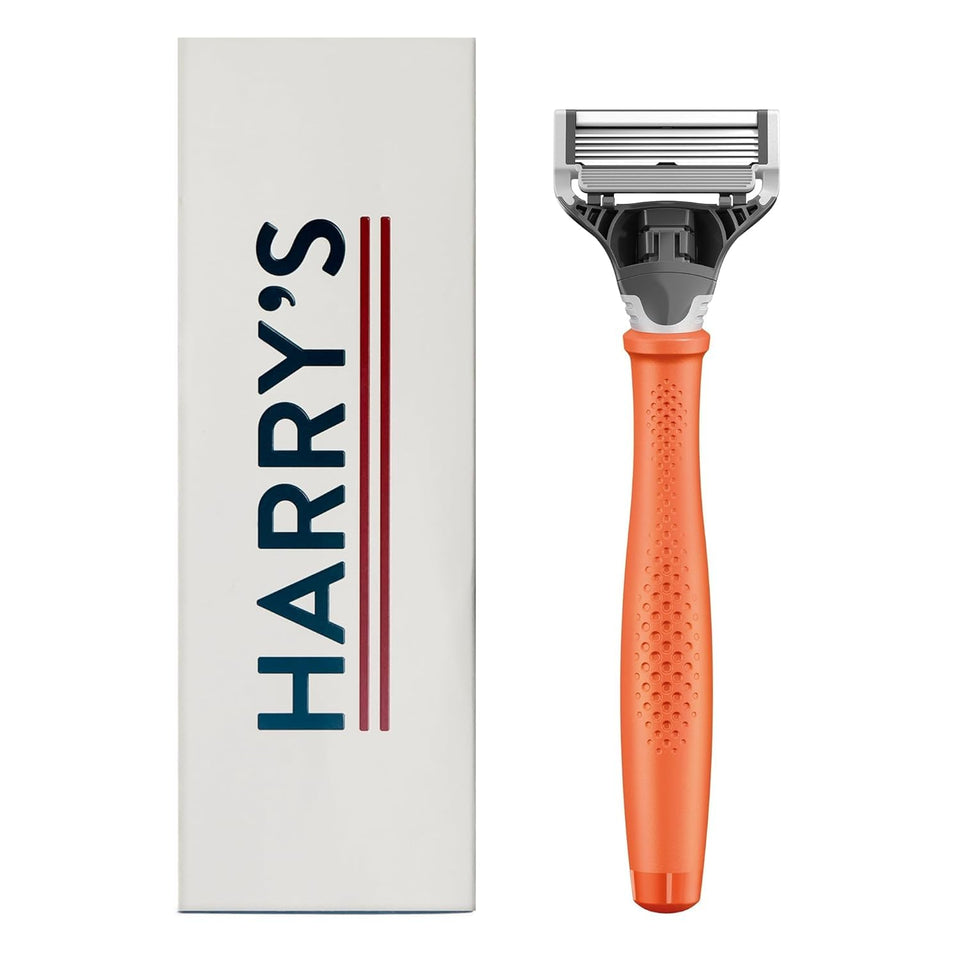 Harry's Truman orange handle front view showing grip and balance benefit