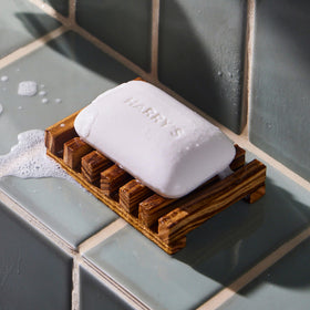 Harry's Wildlands soap on a bathroom shelf conveying a neat grooming routine