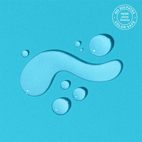 HASK applying oil to wet hair delivering faster drying and detangling benefit