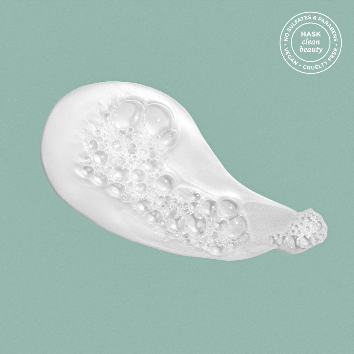 HASK shampoo lather close-up showing creamy foam and gentle texture