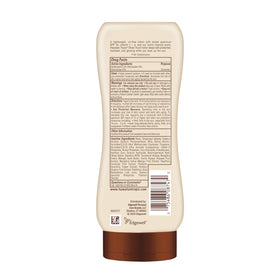Hawaiian Tropic bottle on beach towel conveying water-resistant sun protection