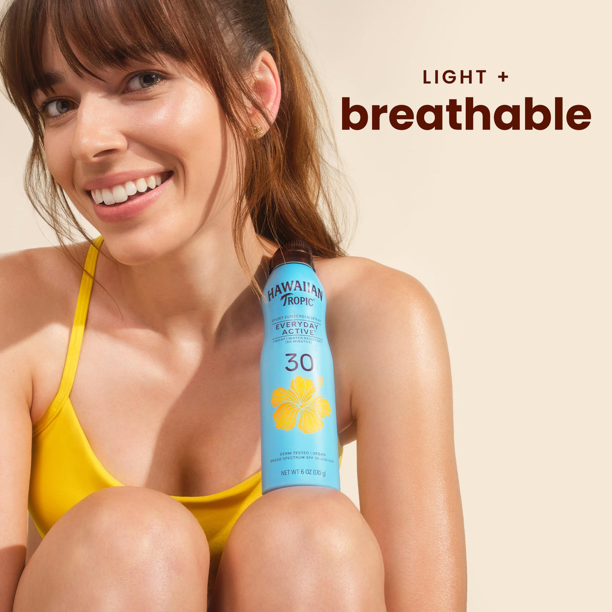Hawaiian Tropic clear spray texture on skin closeup demonstrating non-greasy finish