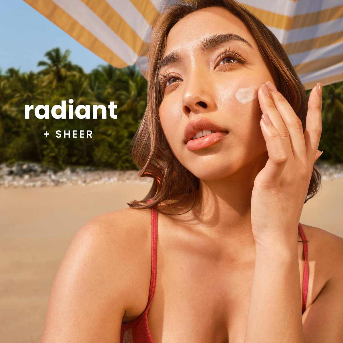 hawaiian tropic sunscreen rubbed on hand demonstrating clear blendability