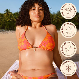 Hawaiian Tropic twin pack next to sunglasses showing size and travel-friendly benefit