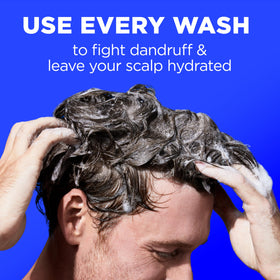 Head & Shoulders bottle in hand showing 31.4 fl oz scale and long‑lasting supply benefit