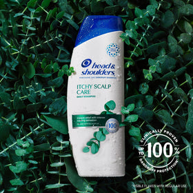 Head & Shoulders shampoo pouring into hand with foam, demonstrating gentle lathering benefit