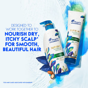 Person applying Head & Shoulders conditioner in the shower to calm scalp and frizz