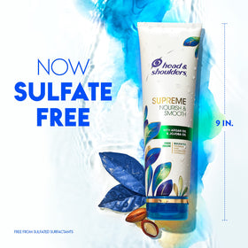 Hand holding the 9.4 fl oz Head & Shoulders bottle for size and scale clarity