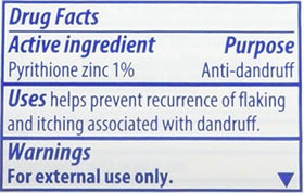 Two 1.7 oz Head & Shoulders bottles next to travel toiletry items showing compact size benefit for flights