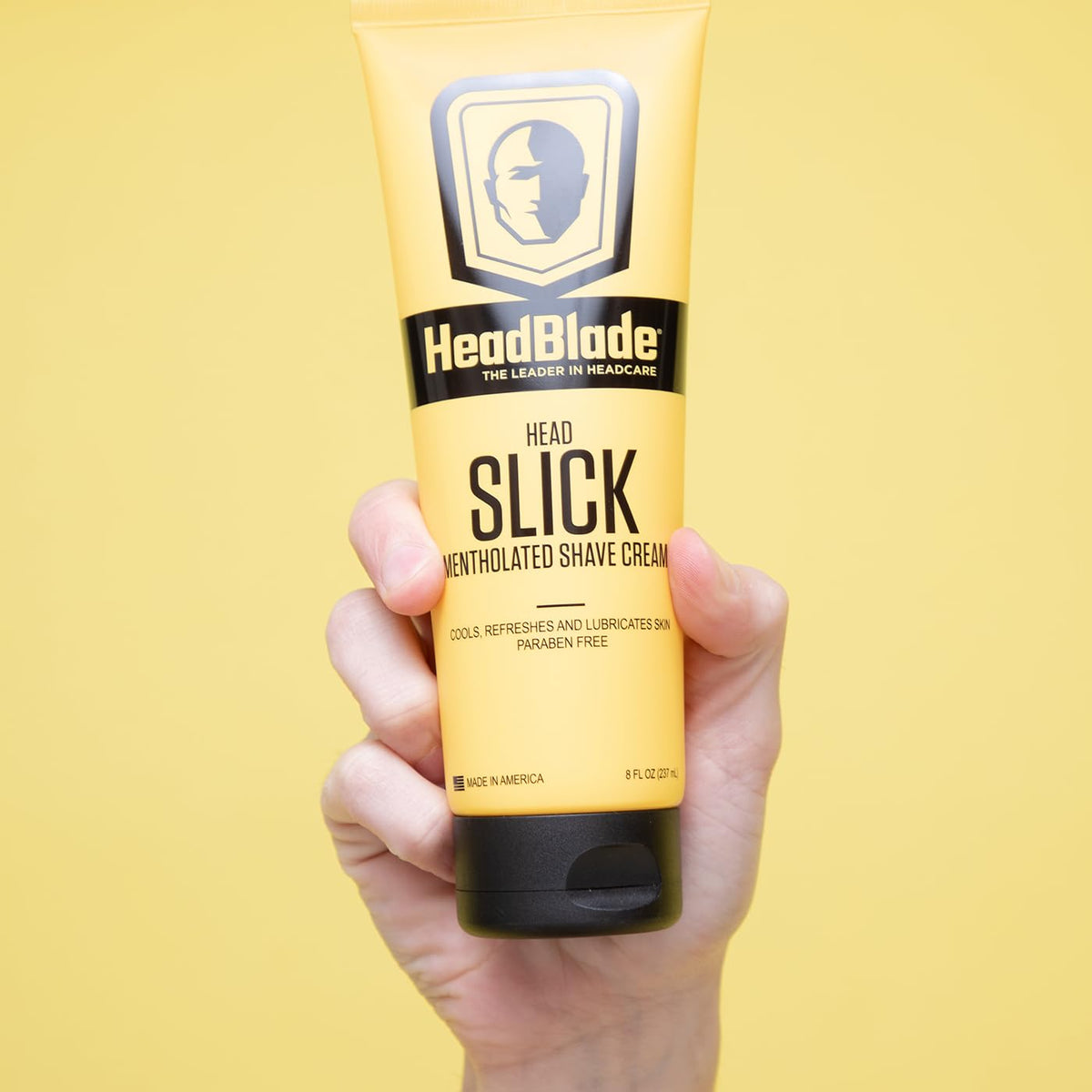 HeadBlade HeadSlick 8 oz next to common items showing true size advantage