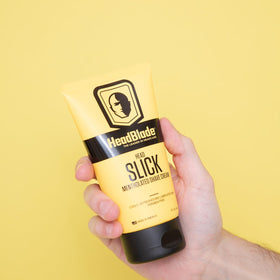 Cream texture on hand from HeadBlade HeadSlick, demonstrates slick glide benefit