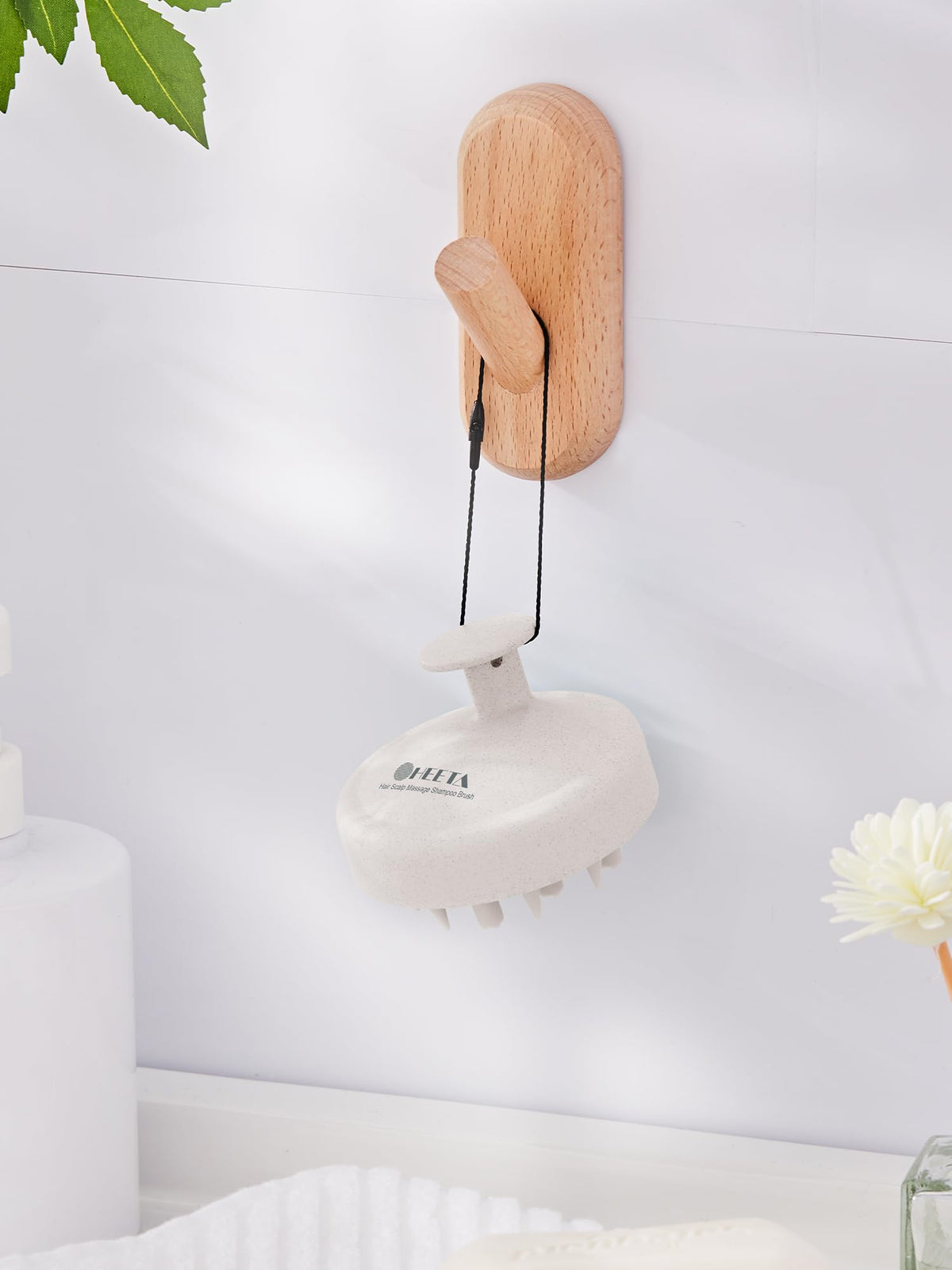 HEETA held in hand for scale showing compact travel-friendly benefit