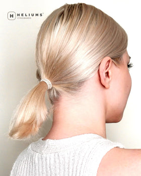 Heliums color matched on blonde hair showing natural blending benefit