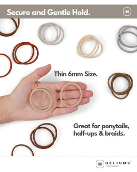 Heliums hair tie held in hand to show compact 1.75-inch scale