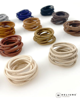 Heliums child wearing mini ponytail holders, gentle and safe for kids