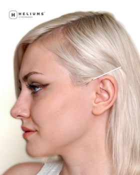 Heliums stylist using pins on a model for professional reliable results