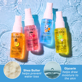 Hempz mini spray held in hand to show compact size and travel convenience