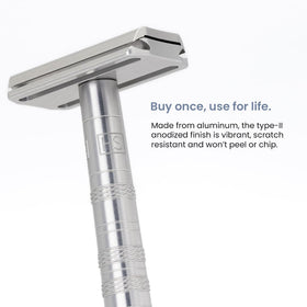 Henson Shaving razor in hand scale comparison to show compact ergonomic size